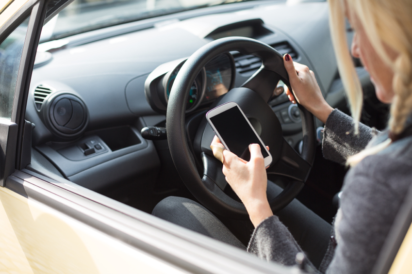 Woman Texting in the Car